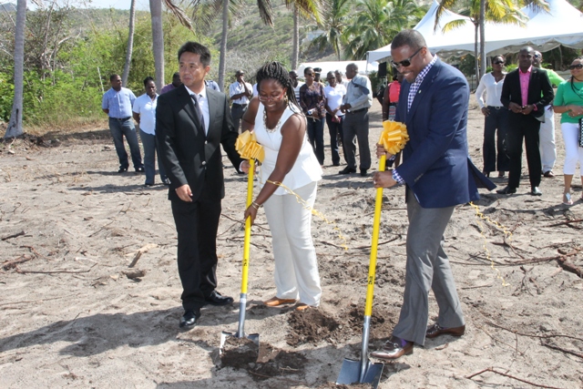 Deputy Premier of Nevis and Minister of Tourism Hon. Mark Brantley and Candy Resort’s Local Office Executive Terrehah Byron break ground for the US$20 million HTRIP Candy Resort Villa Development at Liburd Hill, St. James’ Parish on Nevis on April 17, 2015